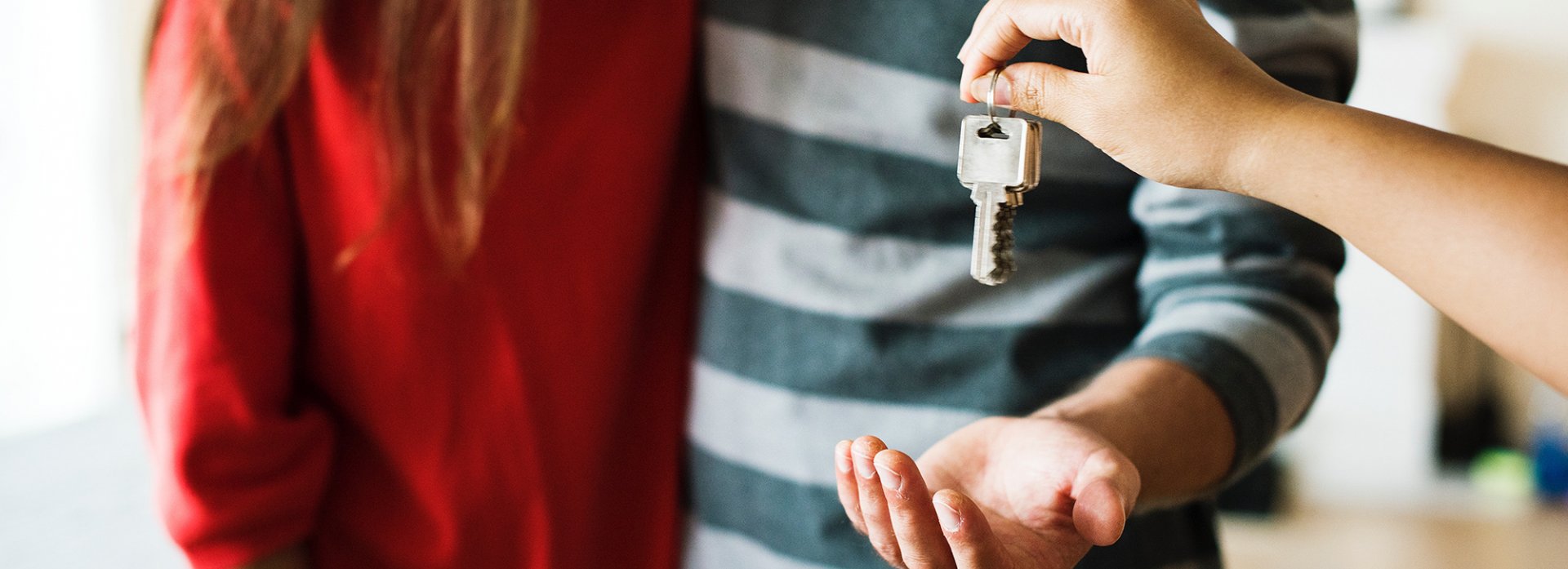 Handing home keys to new buyers